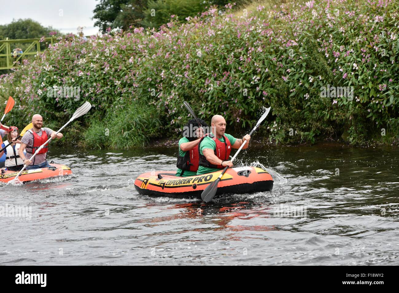 Manchester, UK  30th August 2015 The Annual Northenden Boat Race, started in 2006, goes  about a mile from Simon's Bridge, Didsbury along the River Mersey to Northenden Bridge. This year there are two categories, one for canoes and kayaks, the other for dinghies. A fun event to raise money for The Christie Hospital, it has a competitive edge, with a trophy awarded to the winners of each category. Northenden Boat Race 2015  Manchester, UK Credit:  John Fryer/Alamy Live News Stock Photo