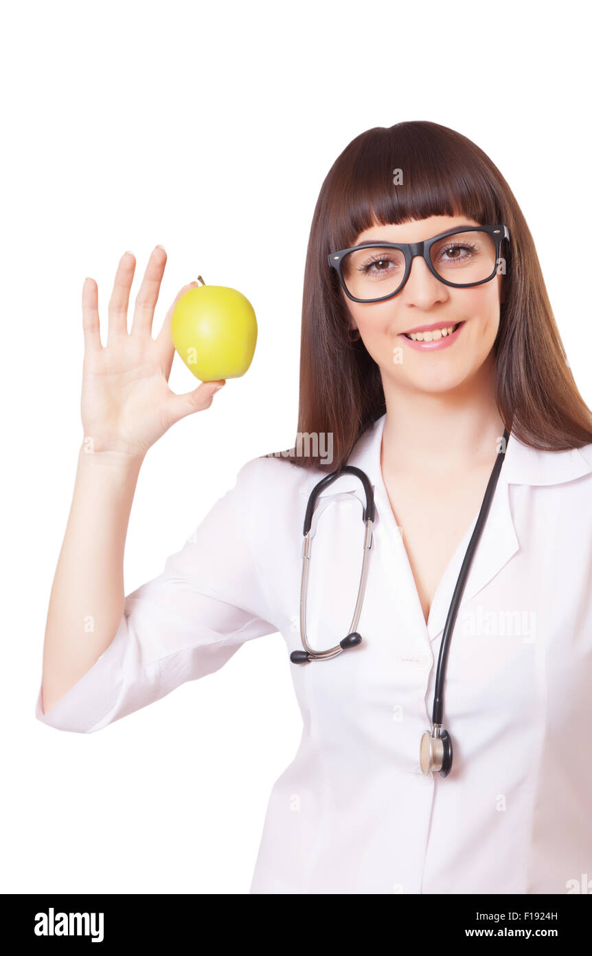 Woman in a white lab coat with apple, isolated on white background ...