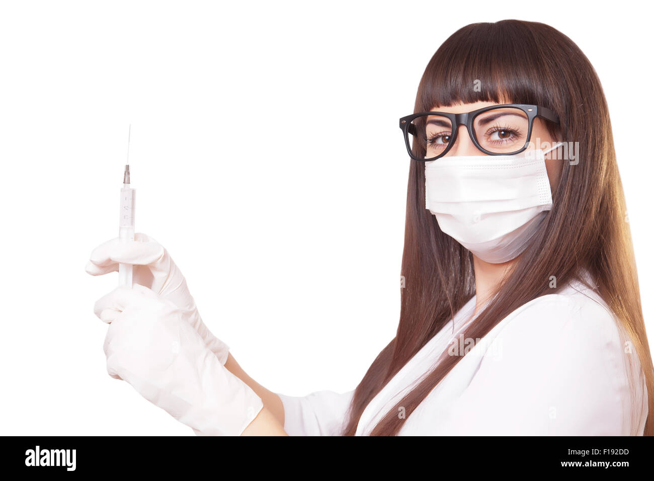 Beautiful young doctor in medical robe holding syringe, isolated on white Stock Photo