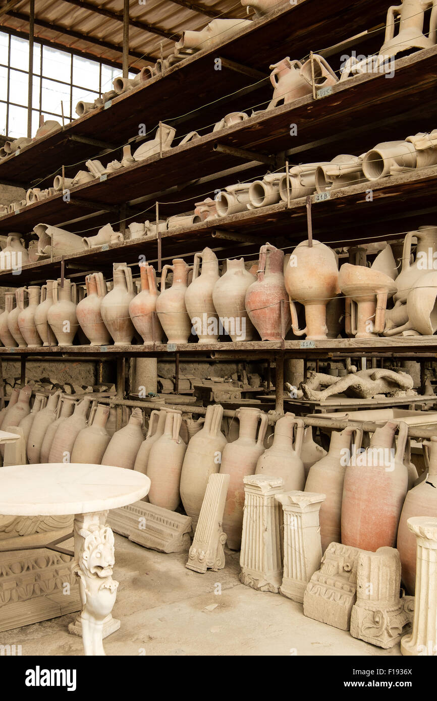 Pots and other artifacts from Pompeii in storage and on display on