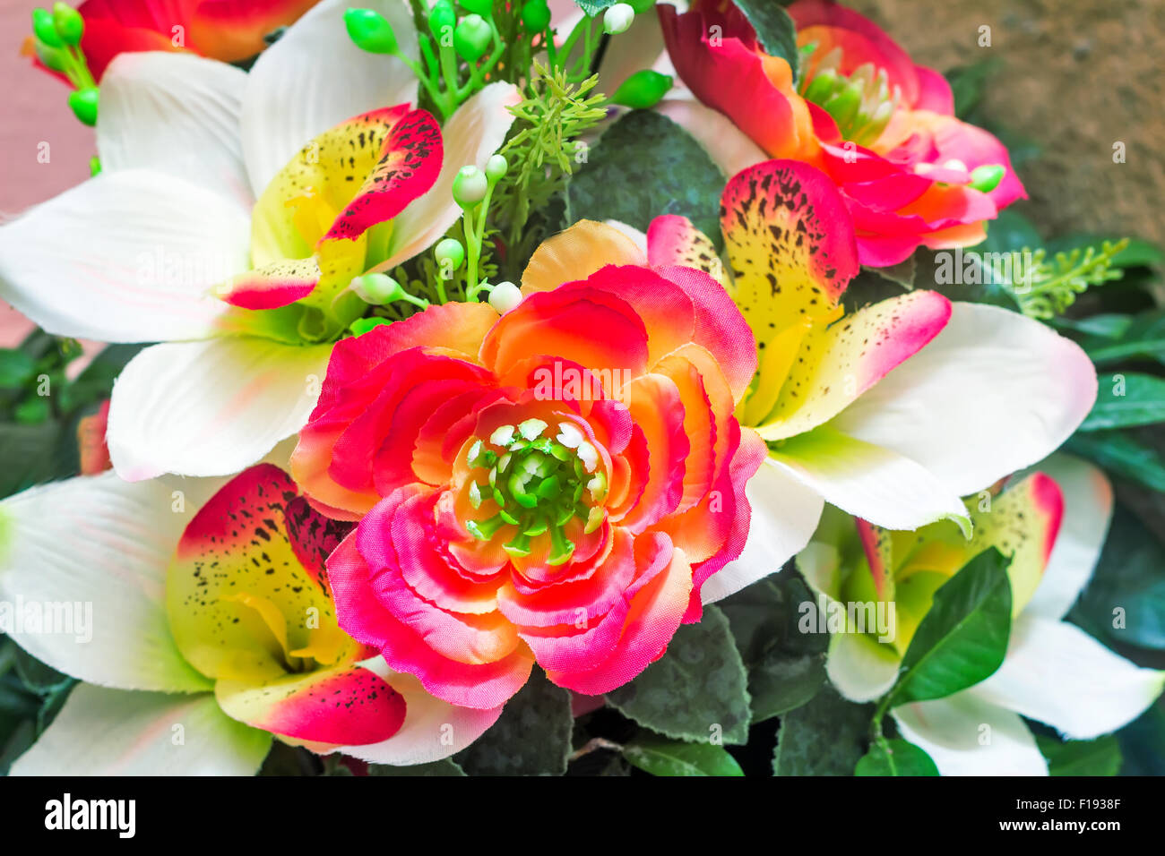 Beautiful hot pink and white artificial flowers with buds and leaves
