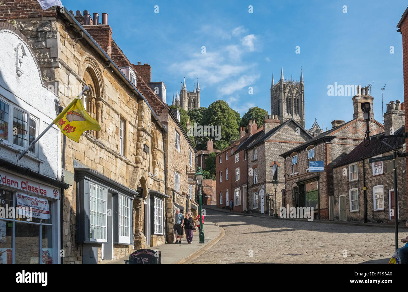 Characterful buildings on Steep Hill, Lincoln, Lincolnshire, UK, with Lincoln Cathedral in the background. Stock Photo