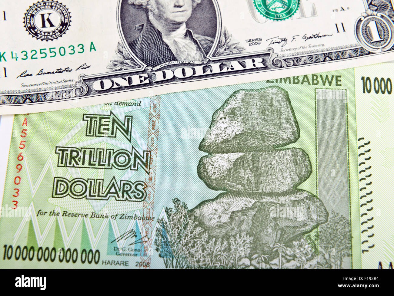 Zimbabwe ten trillion dollars bill and one American dollar. Inflation concept Stock Photo