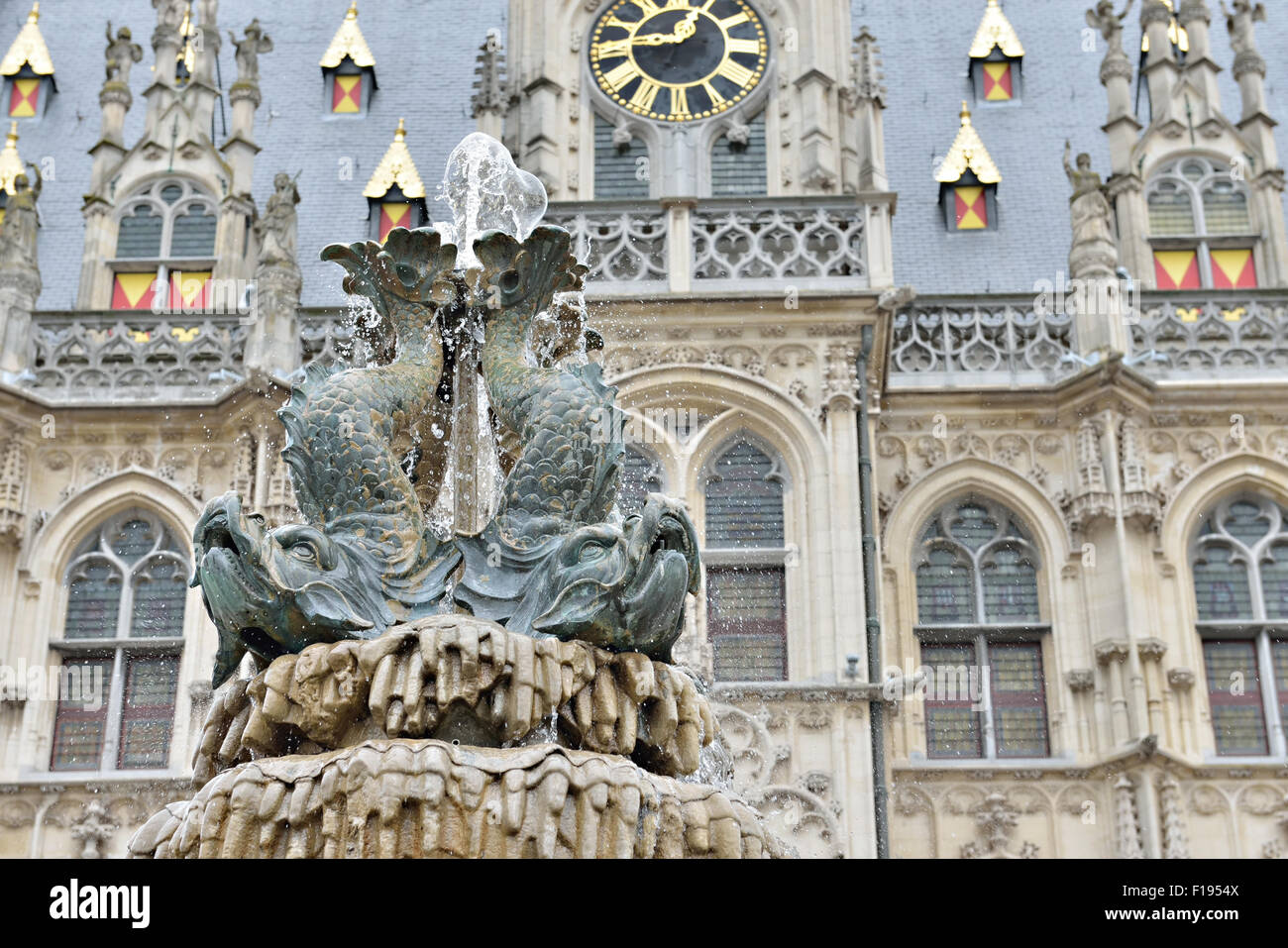 Medieval fountain on front of city hall of Oudenaarde, Belgium Stock Photo