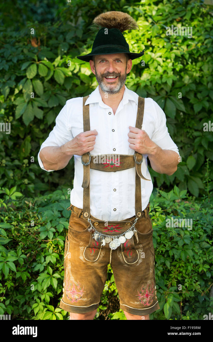 portrait of a bavarian man with hat and leather pants Stock Photo