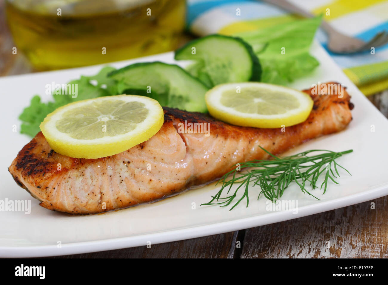 Grilled salmon fillet with lemon and fresh dill Stock Photo