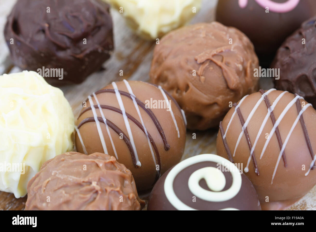 Assorted milk, white and dark chocolates, close up Stock Photo