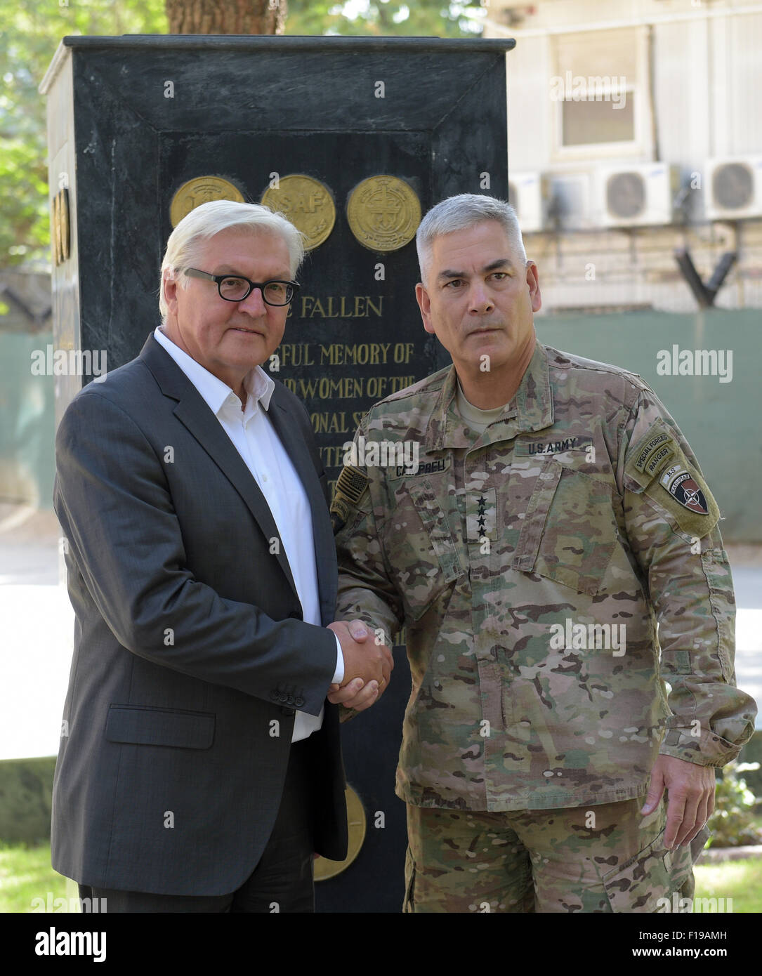 Kabul, Afghanistan. 30th Aug, 2015. German Foreign Minister Frank-Walter Steinmeier (L, SPD) shakes hands with commander of the Resolute Support Mission, General John F. Campbell, in the NATO compond in Kabul, Afghanistan, 30 August 2015. Steinmeier is on a two-day visit to the region. PHOTO: RAINER JENSEN/DPA/Alamy Live News Stock Photo