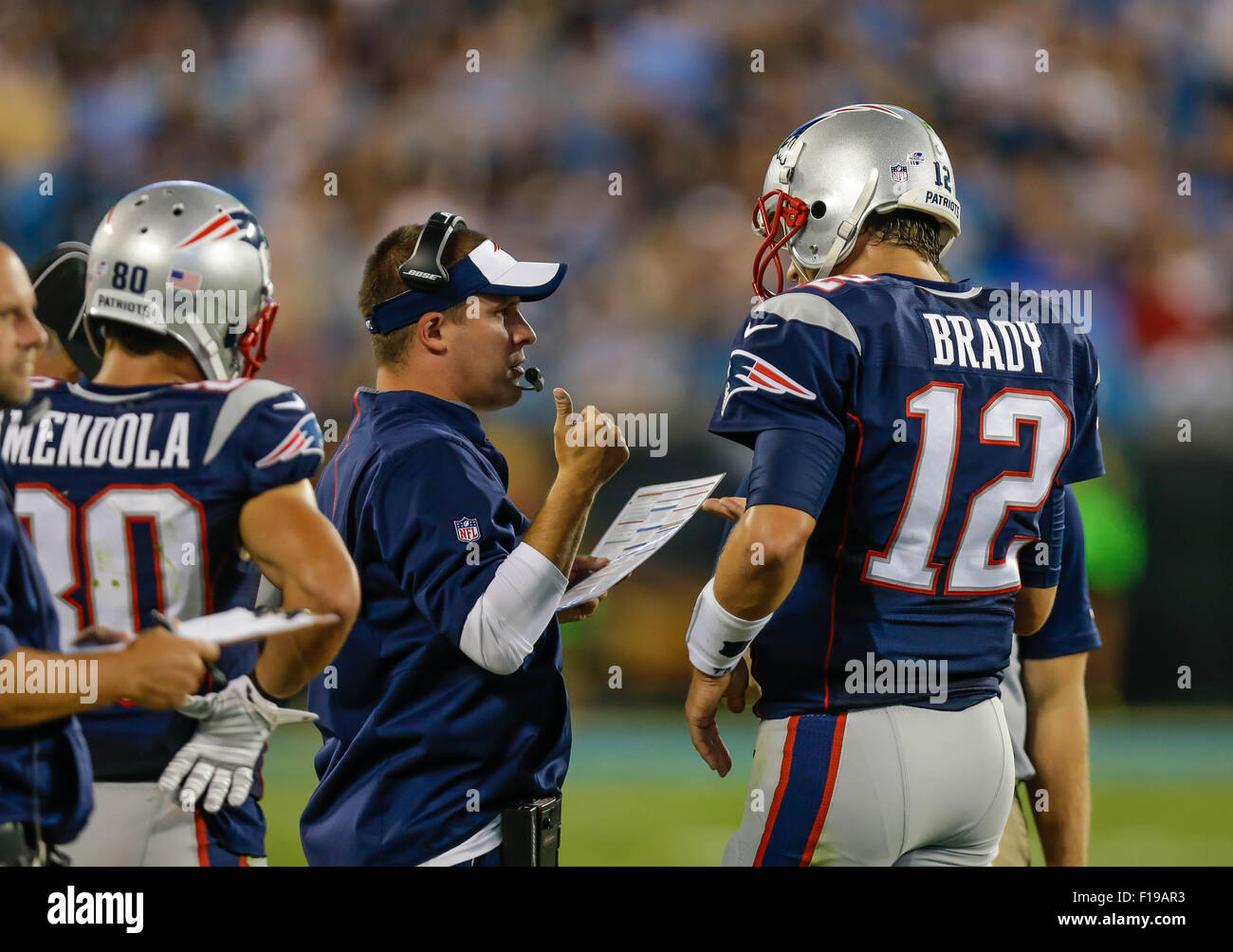 August 28, 2015 Charlotte, New England Patriots quarterback Tom Brady #12 confers with offensive coordinator Josh McDaniels in a game against the Carolina Panthers on August 28, 2015, at Bank of America Stadium in Charlotte, North Carolina. The Patriots defeated the Panthers 17-16. Margaret Bowles/CSM Stock Photo