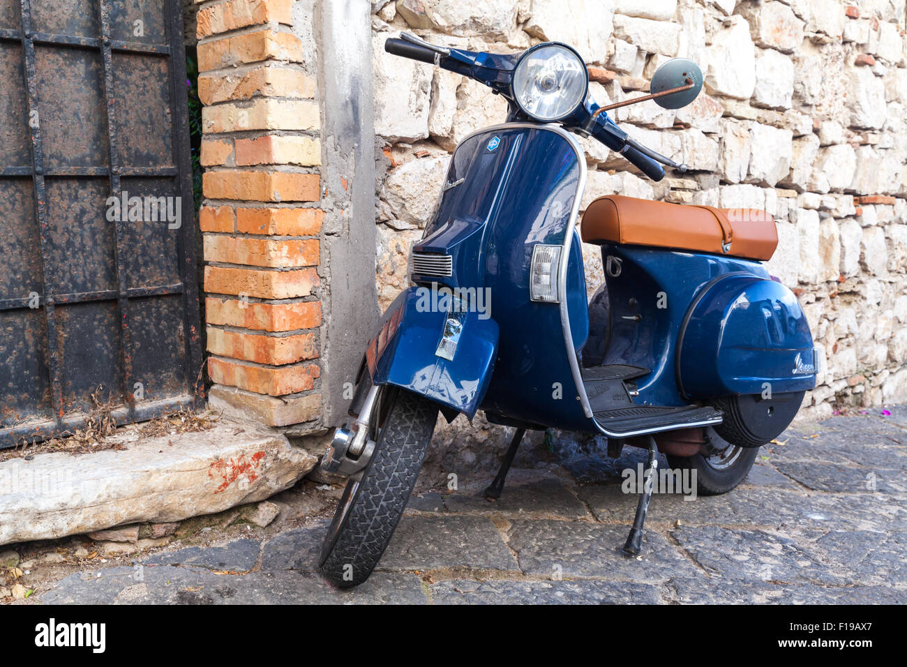 Gaeta, Italy - August 19, 2015: Classic blue Vespa PX 150 scooter stands parked in Italian town Stock Photo