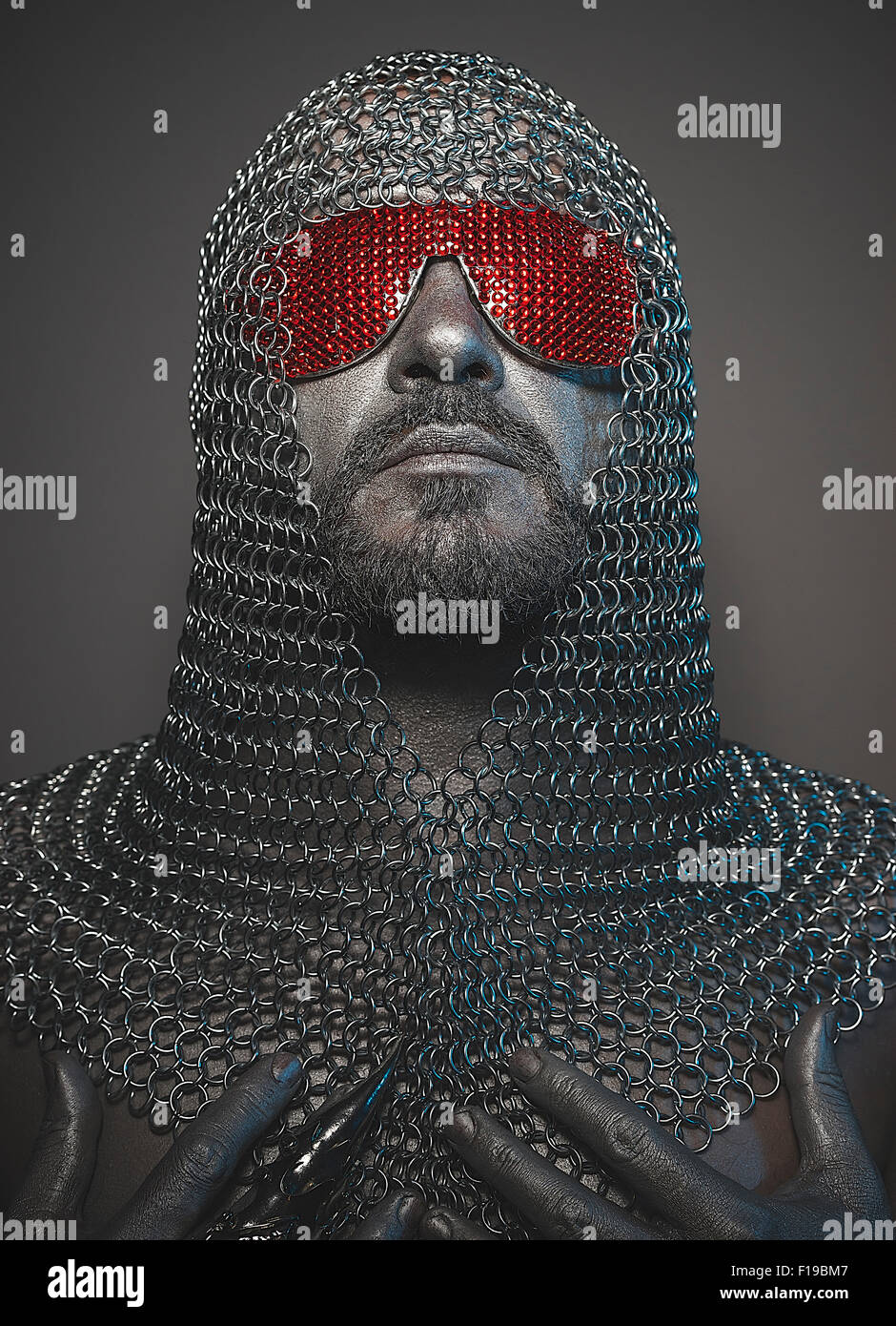 medieval executioner mesh iron rings on the head Stock Photo