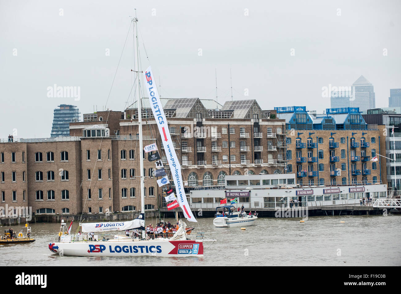 London, UK. 30 August 2015.  DSP Logistics, one of the twelve yachts competing in the Clipper Round the World race, leaves their moorings in St. Katherine's Dock for their journey down the River Thames for the start of their 40,000 mile, 11 month race.  Each yacht comprises a crew of 22 - professional skipper and the remainder amateurs, many of whom had never sailed before taking up the challenge. Credit:  Stephen Chung / Alamy Live News Stock Photo