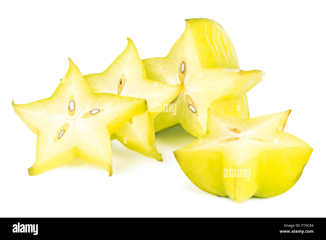 Close-up of four carambola (starfruit) slices, isolated on white background. Stock Photo