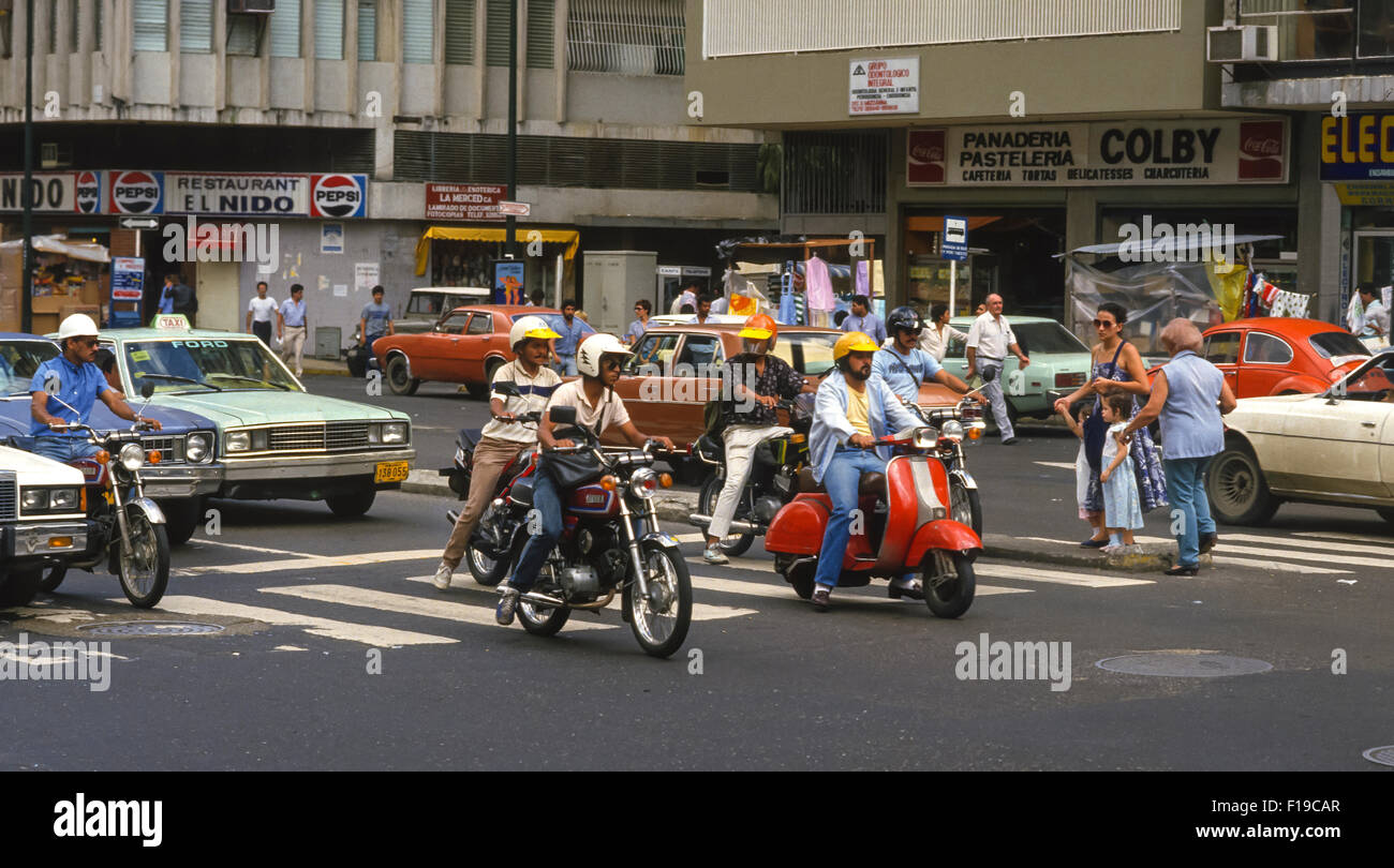 CARACAS, VENEZUELA - Scooter motorbikes and cars on street. 1988 Stock Photo