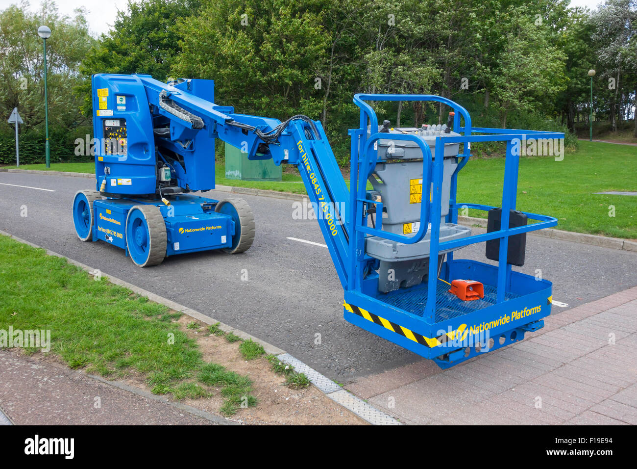 A small self powered boom type access platform for building inspection and repair Stock Photo