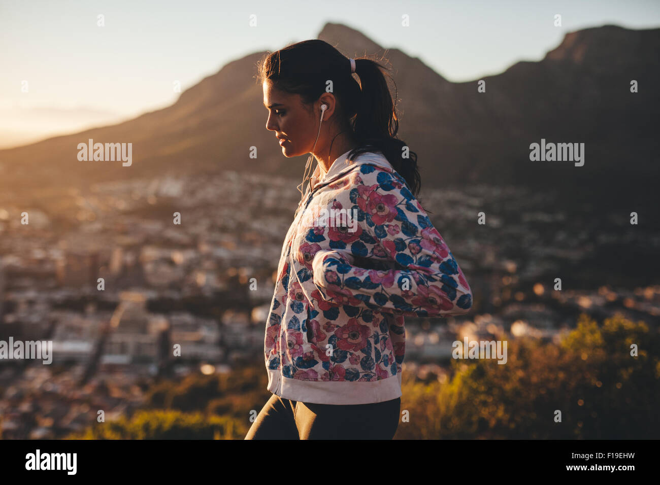 Side view of young caucasian woman on morning walk. Woman walking ...