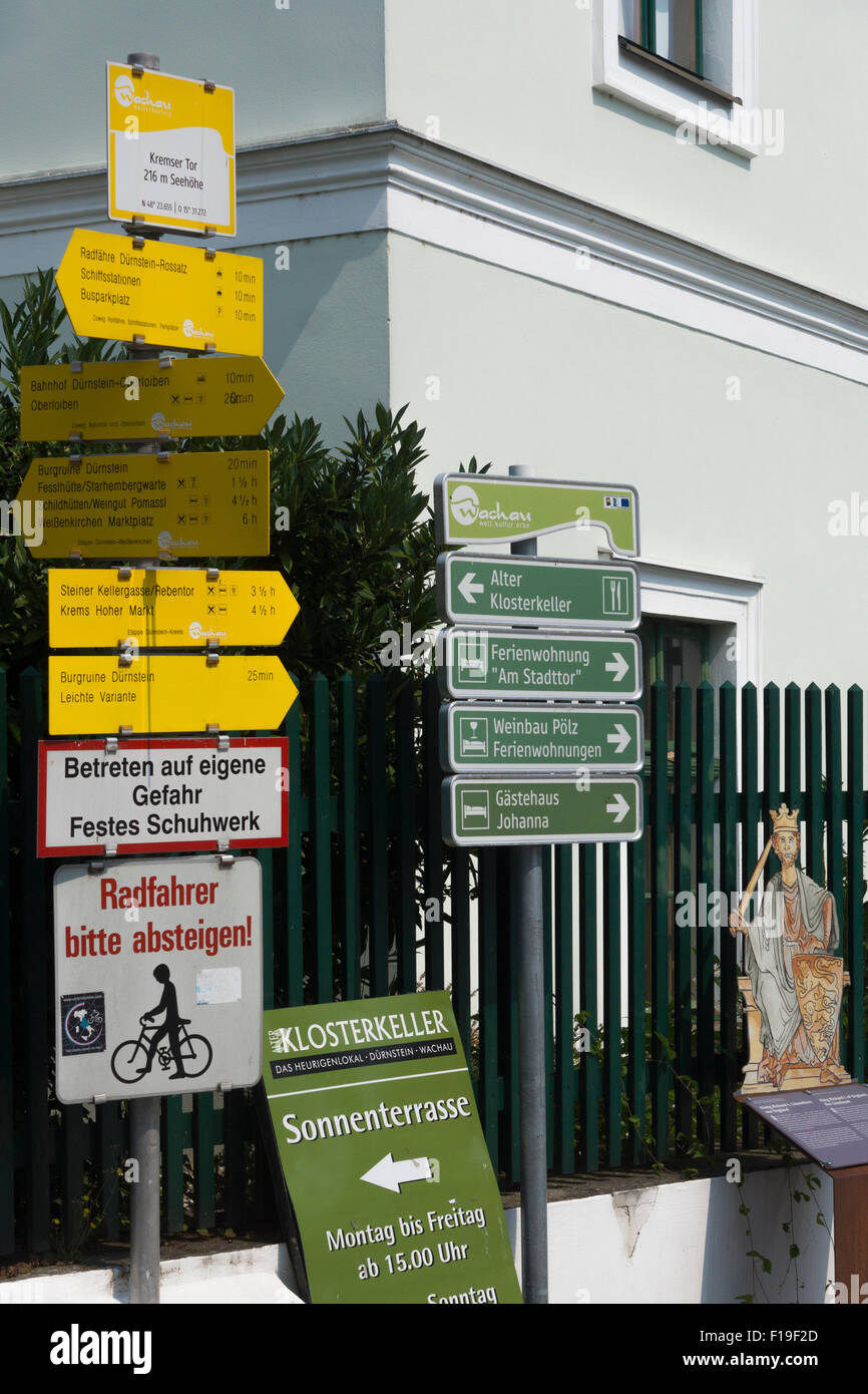 German language streetsigns for tourists, walkers and cyclists at Kremser Tor (gate) in Dürnstein Stock Photo