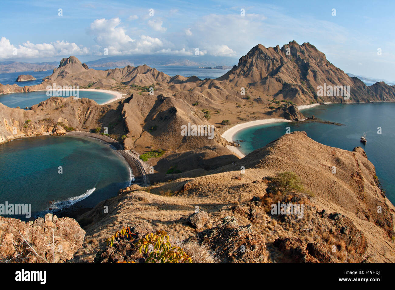 px91466-D. amazing view from atop Padar Island, Komodo National Park. Dive boat 'Seven Seas' in bay. Indonesia, Pacific Ocean. P Stock Photo