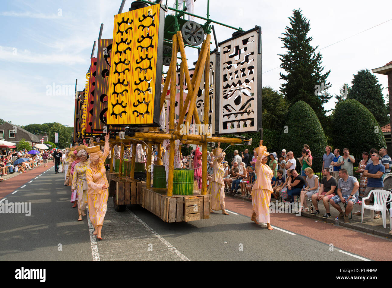 Cultural parade in the village Heeze in the Netherlands depicting the history of the 'Vlisco' company and its founder.... Stock Photo
