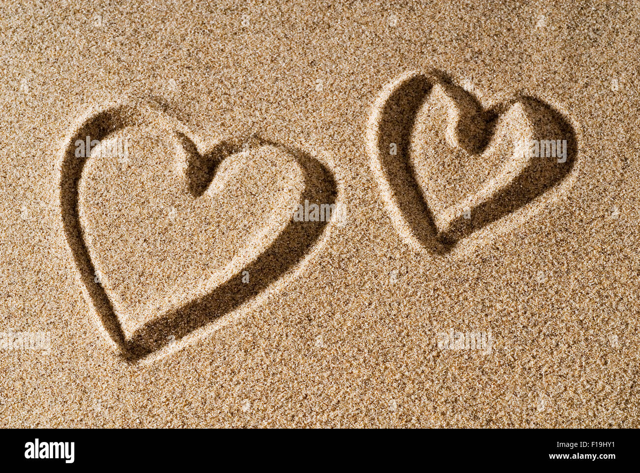 A heart painted in the sand Stock Photo