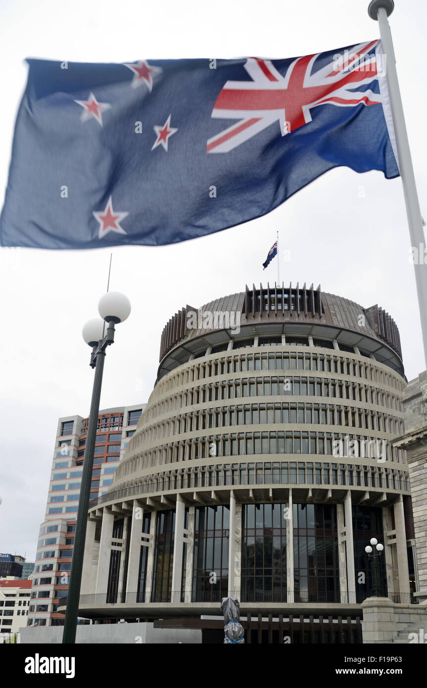 The New Zealand flag flies high over Parliament House at Wellington, New Zealand Stock Photo