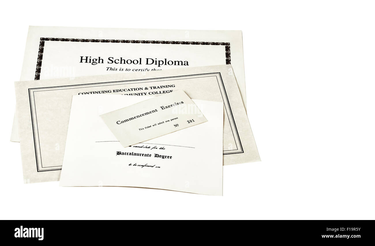 Education certification documents including high school diploma,commencement ticket, and continuing education certificate Stock Photo