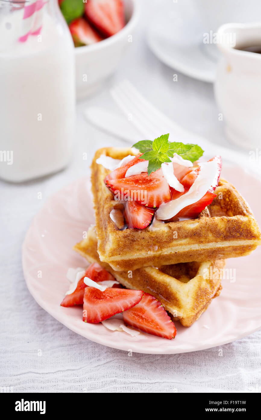 Ricotta waffles served with fresh strawberries and maple syrup Stock Photo