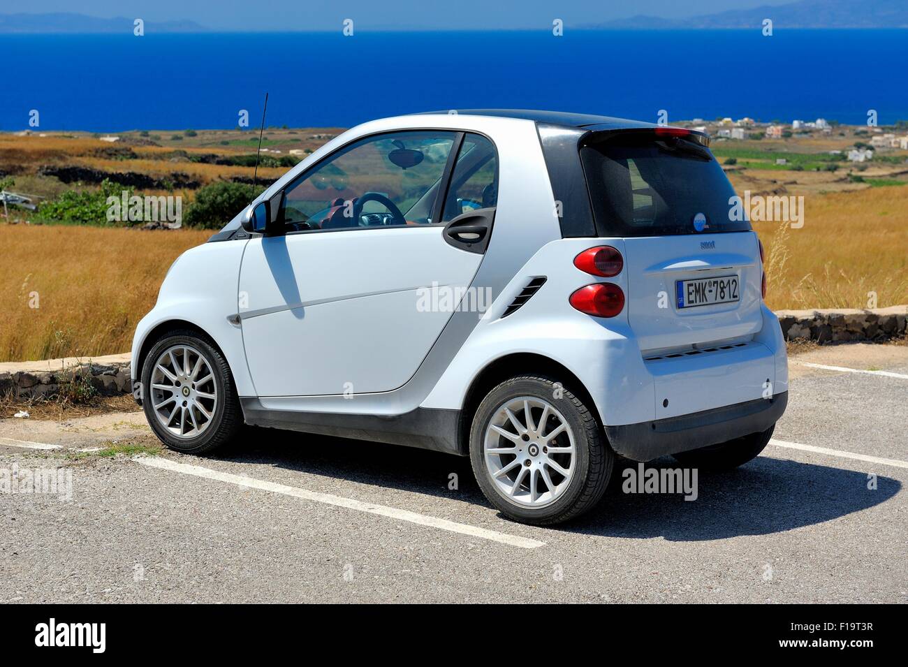 A Smart car parked in a car park Santorini Greece Stock Photo