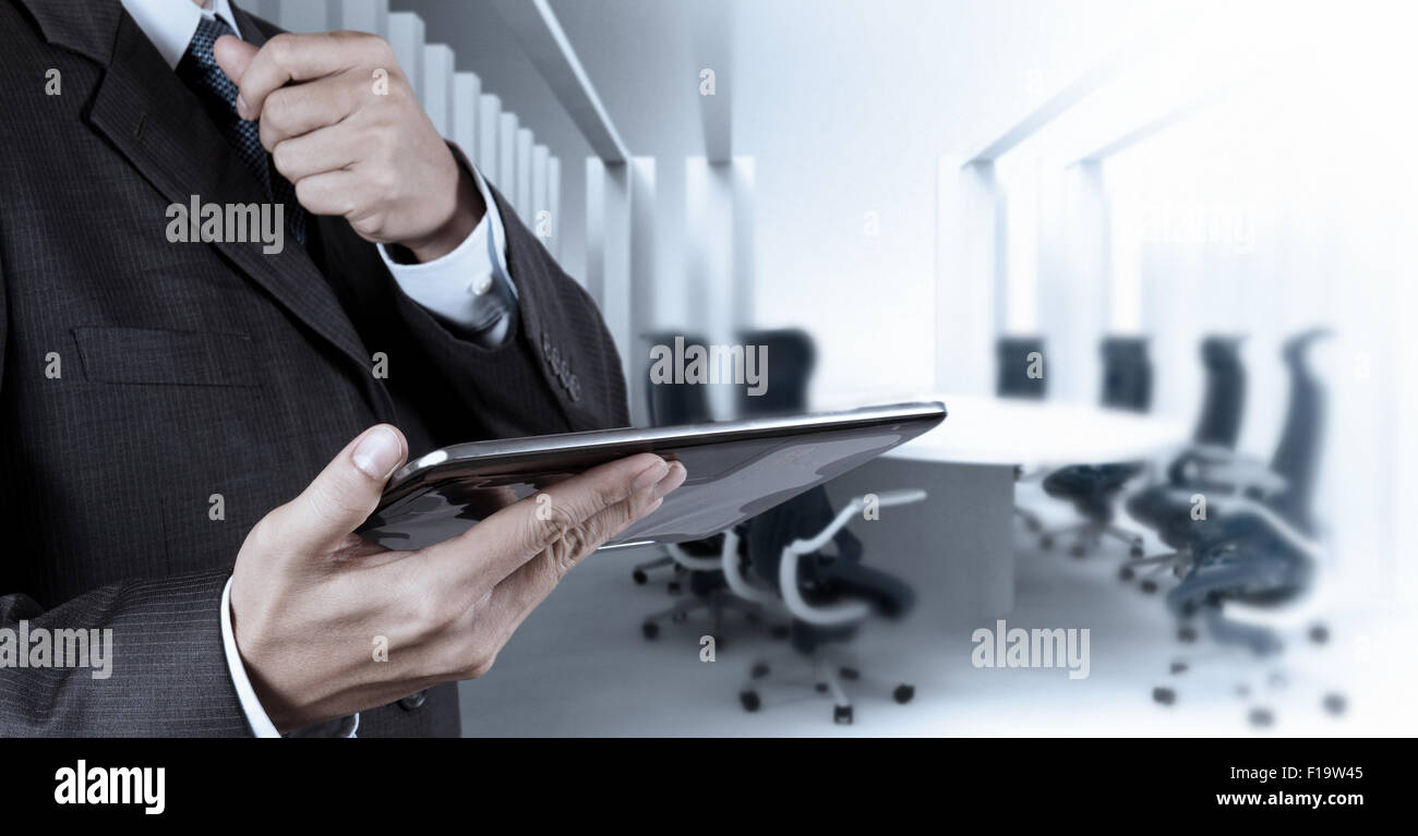 Businessman hand working with a digital tablet on meeting room ...