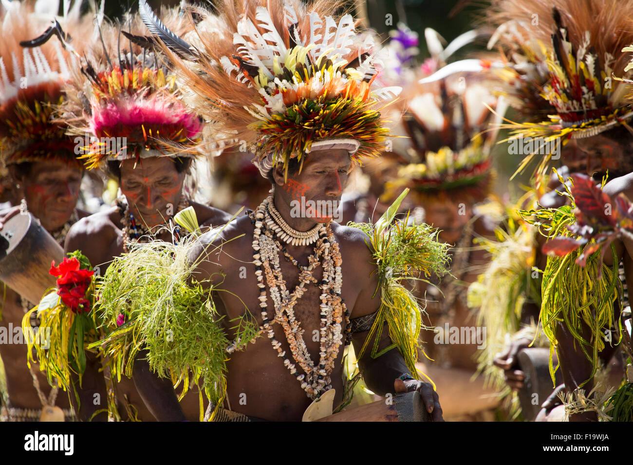 Papua New Guinea, South Eastern peninsula of Cape Nelson, Tufi, Group of local males dancing in traditional costume. Stock Photo