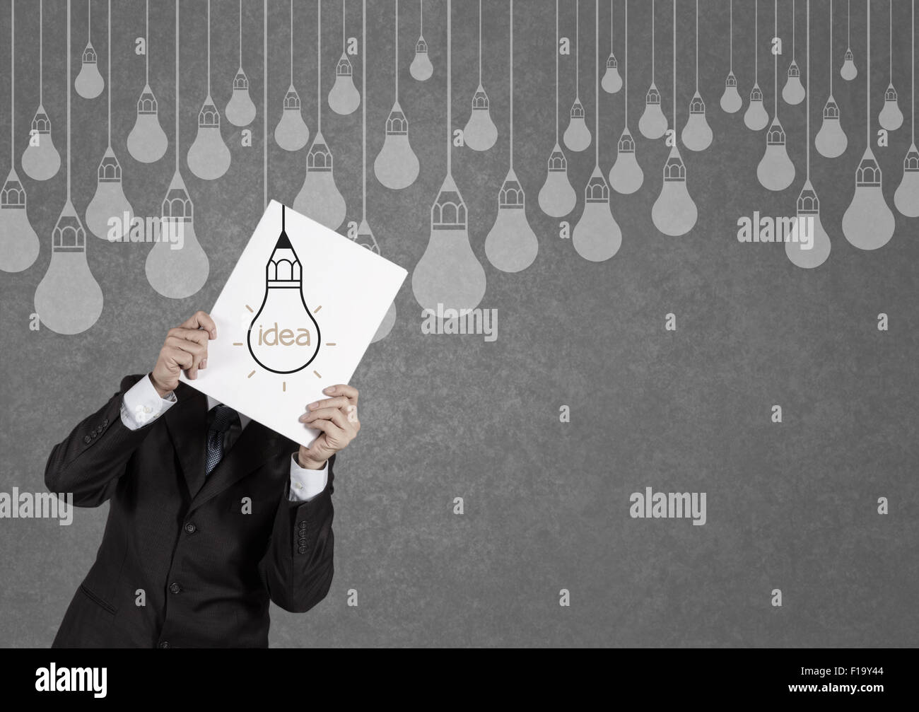 businessman showing the book of drawing idea light bulb concept ...