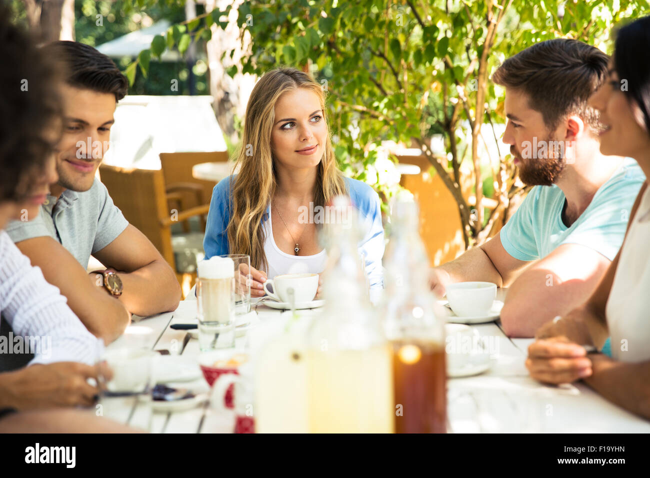 Group of a friends enjoying outdoor dinner party Stock Photo