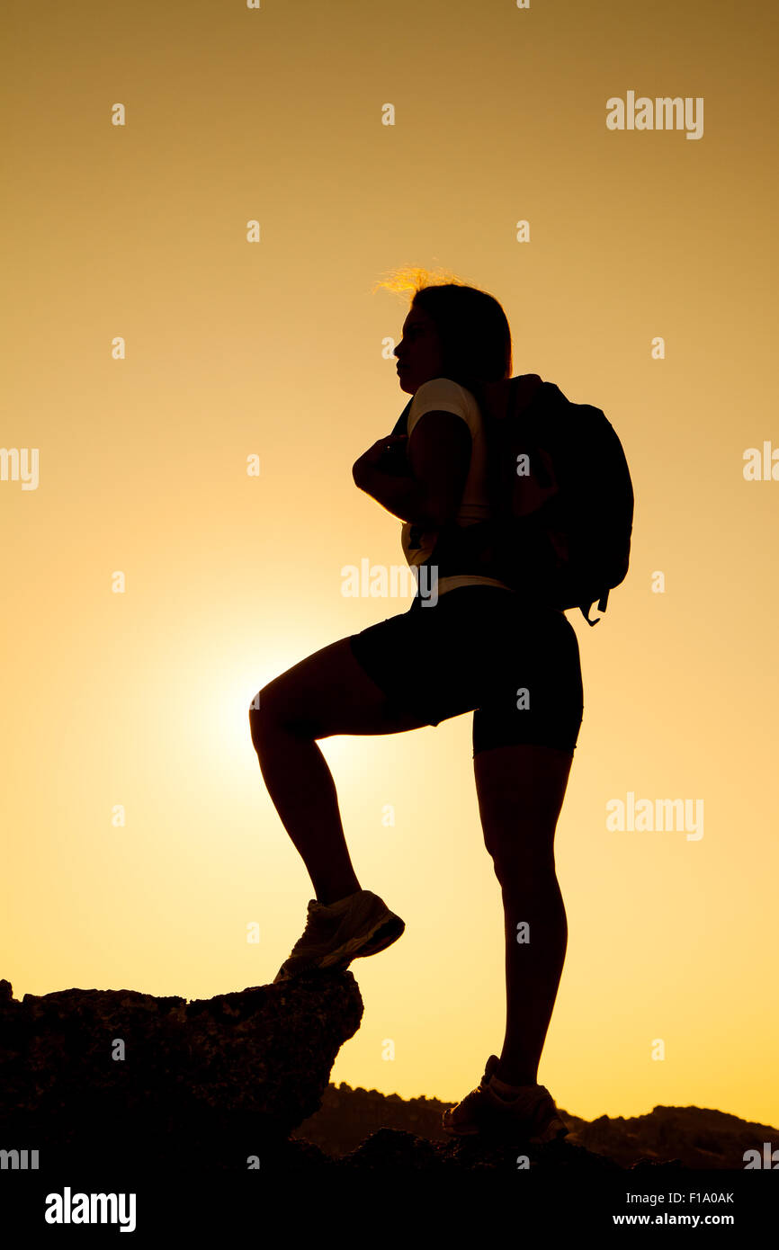 Sunset hiker silhouette on rock hi-res stock photography and images - Alamy