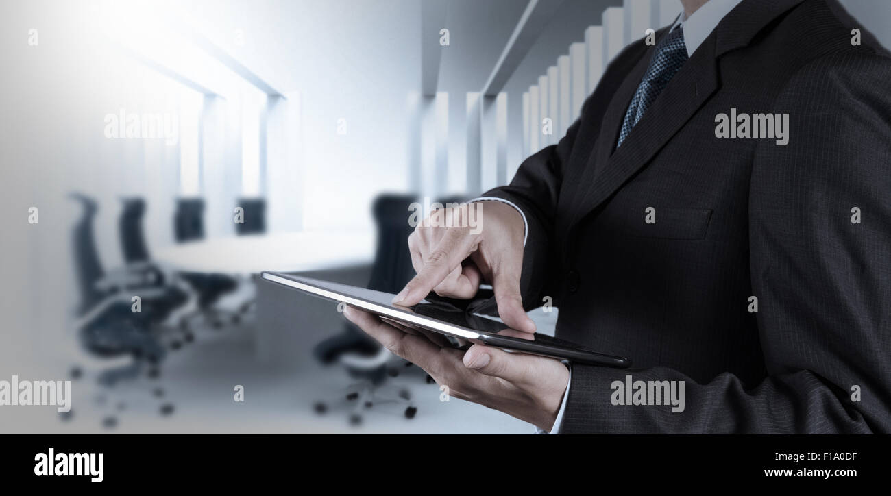 Businessman hand working with a digital tablet on meeting room ...