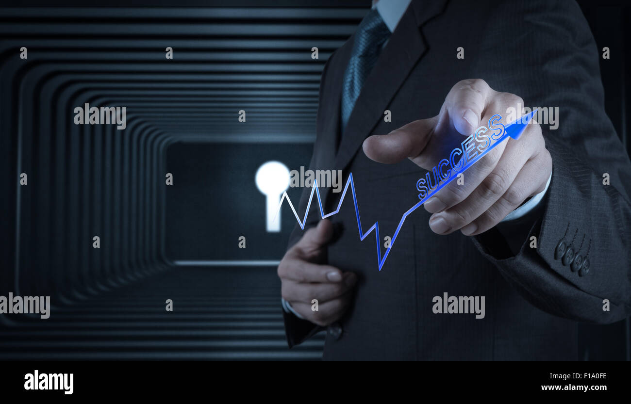 Businessman hand with key to success as concept Stock Photo - Alamy