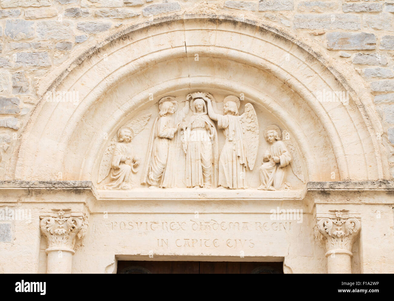 Stone carving above church door Montaud, Hérault,  Languedoc-Roussillon, France, Europe Stock Photo