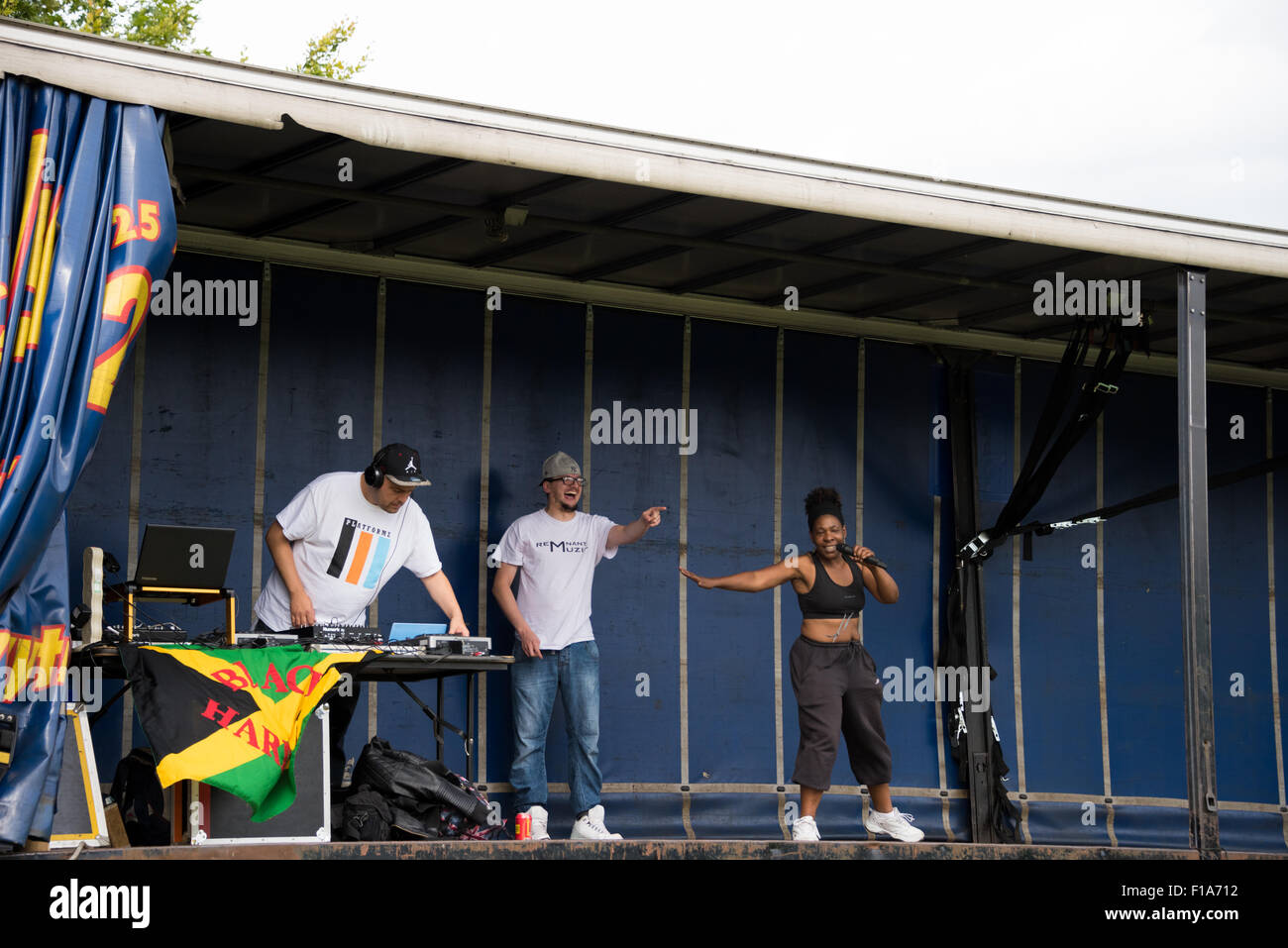 An African Girl singing on stage with a man rapping at West Park ...