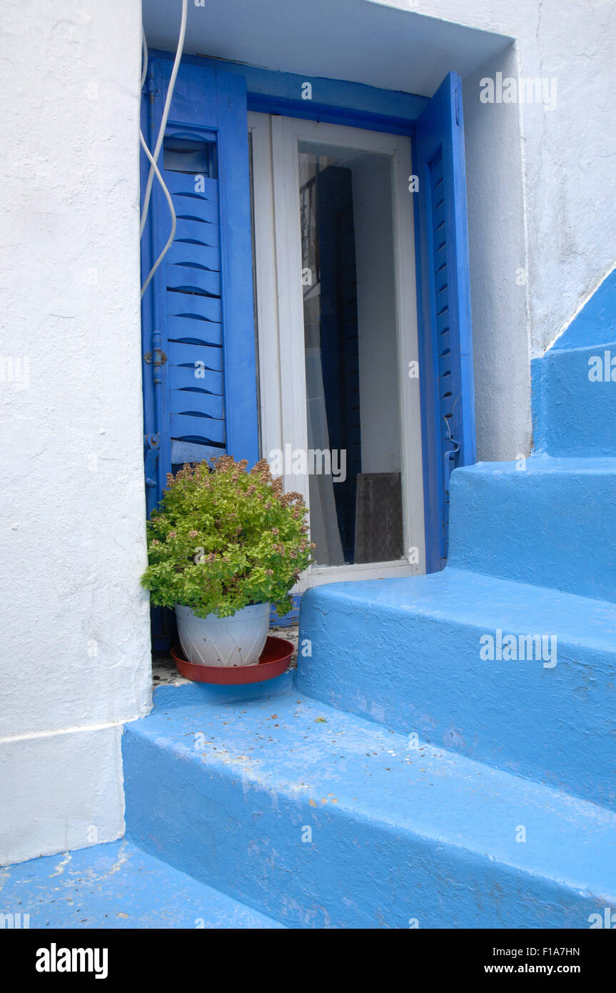 Blue steps and shutters in Skiathos town Stock Photo