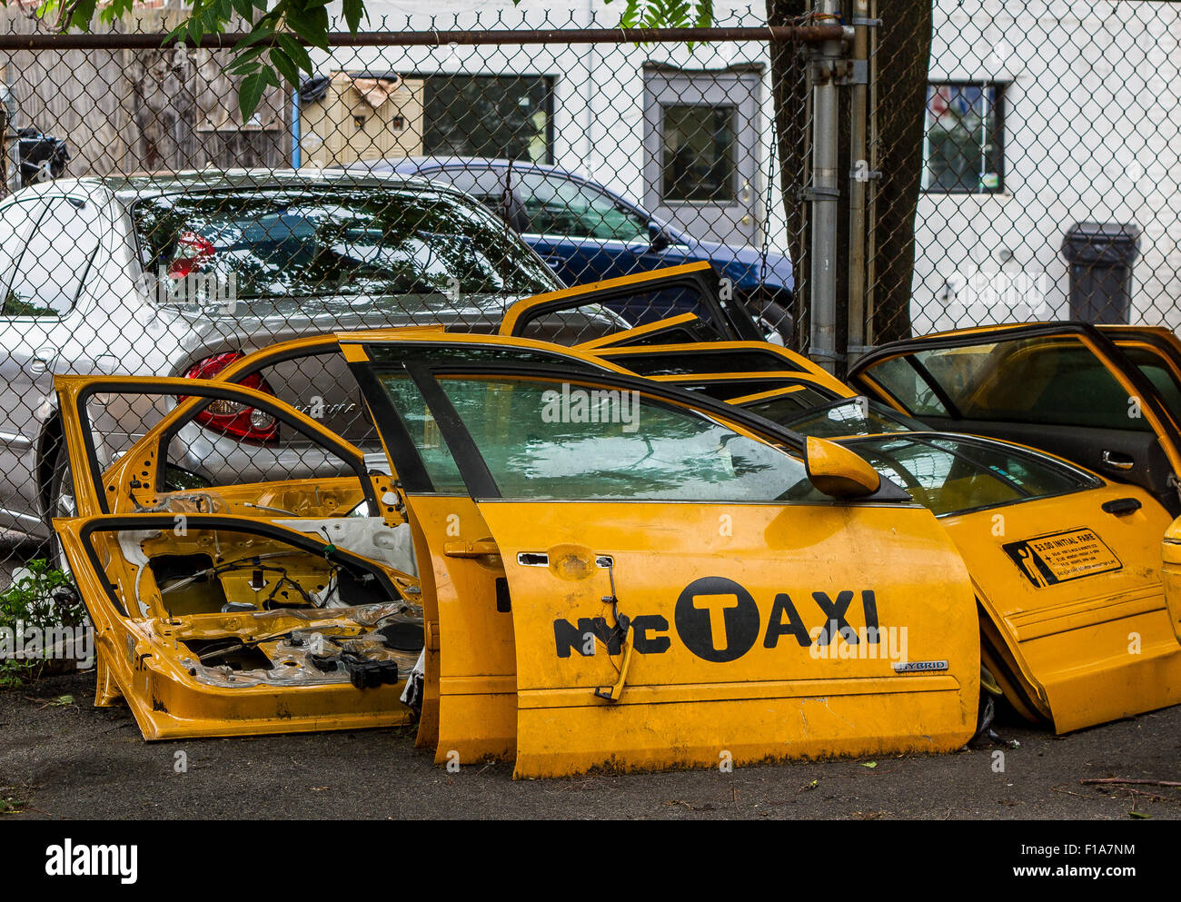 Scrapped yellow  New York Taxi Cab doors in Long Island City NY Stock Photo
