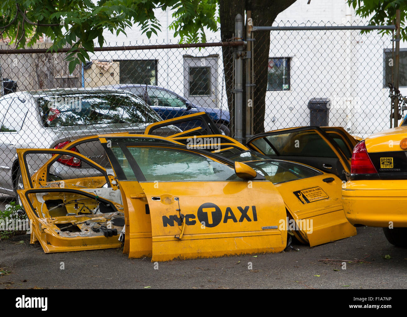 New York taxi cab doors at a scrap yard in Long Island City NY, USA Stock Photo