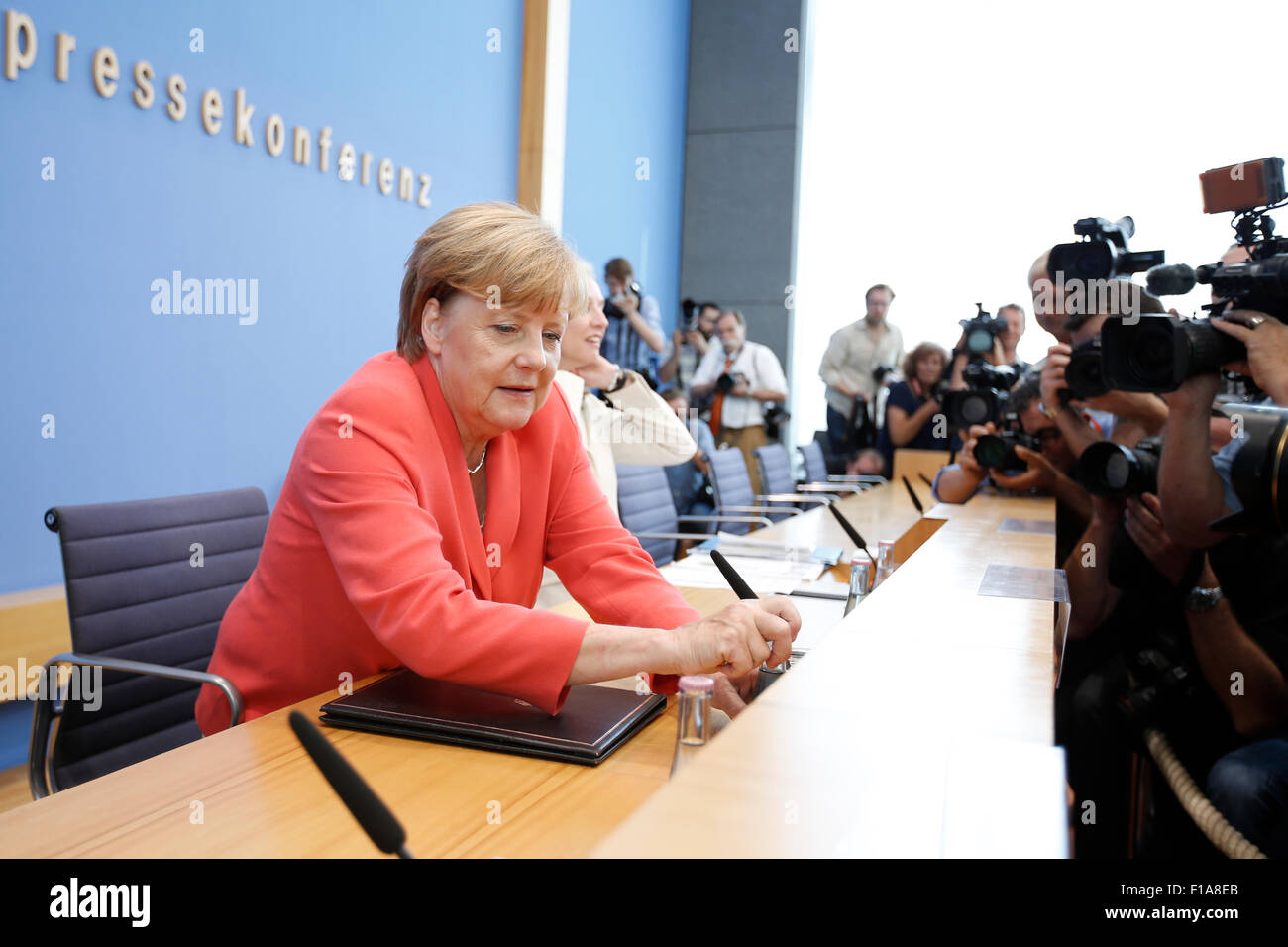 German Chancellor Angela Merkel during press conference on foreign and domestic policy at the house of the federal press conference in Berlin, Germany on 31 august 2015. / Picture: Angela Merkel, german chancellor, answering questions about foreign and domestic policy during a press conference at the house of the federal press conference in Berlin. Stock Photo
