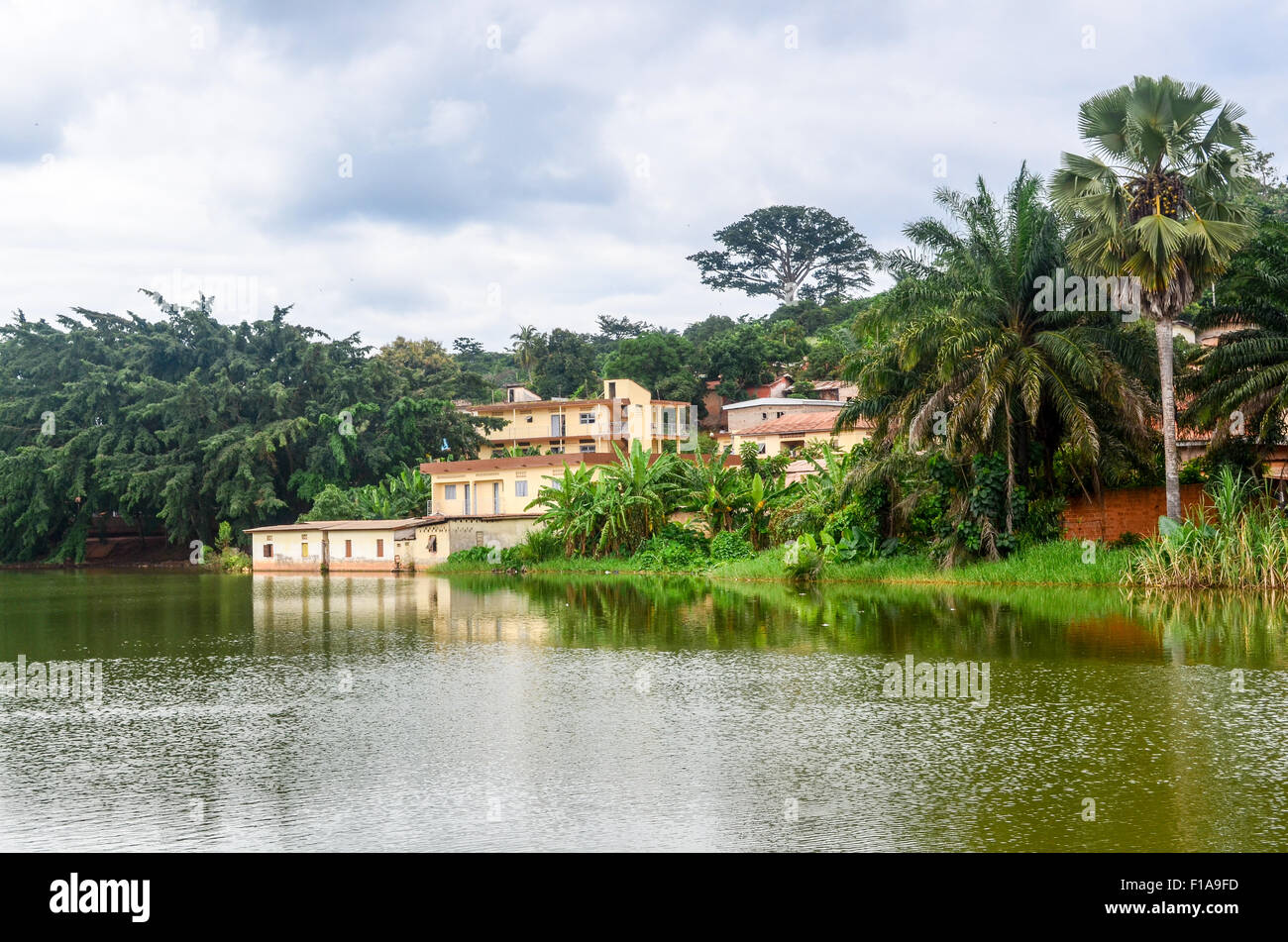 Houses by a lake in Ivory Coast Stock Photo Alamy