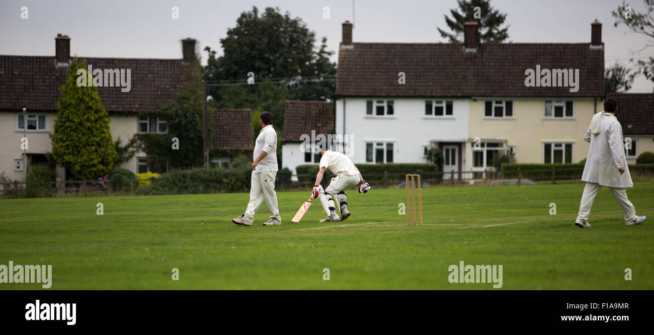 Aston village in Hertfordshire cricket being played on The Greeen Stock Photo Alamy