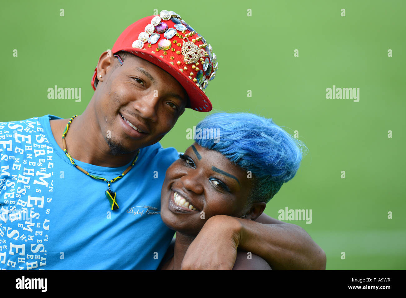 Happy smiling couple man and woman with hair dyed blue Uk Stock Photo