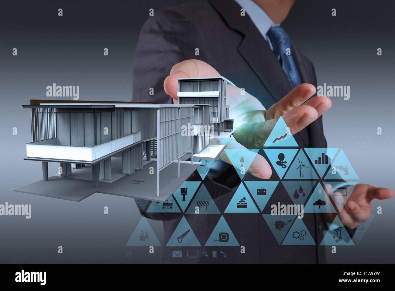 businessman hand working with new computer interface show building development concept Stock Photo