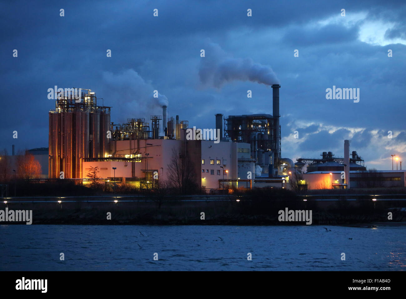 Wismar, Germany, industrial plant of Klausner Nordic Timber at dusk Stock Photo