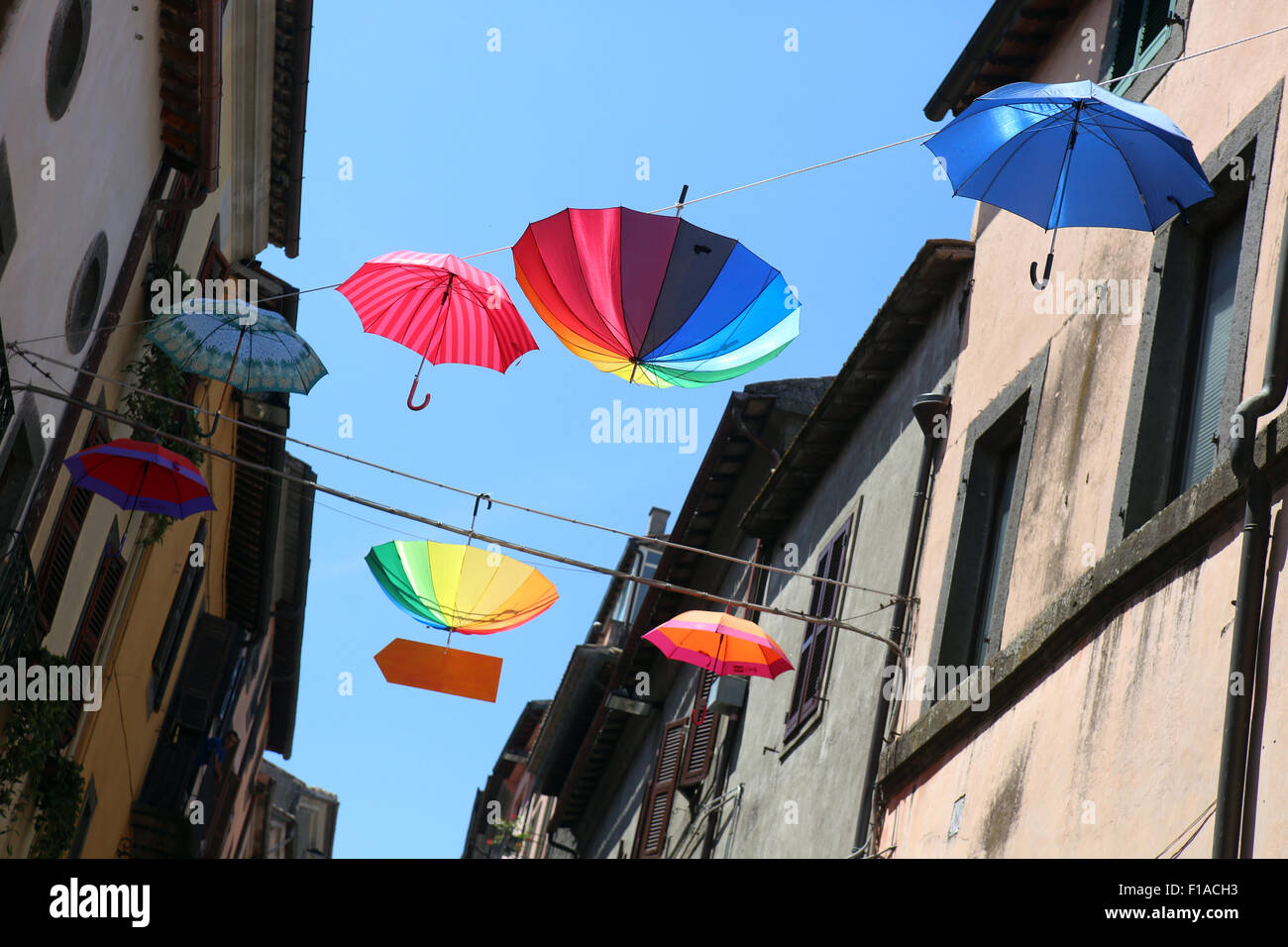 Bomarzo, Italy, umbrellas hanging in sunshine on a clothes line Stock Photo