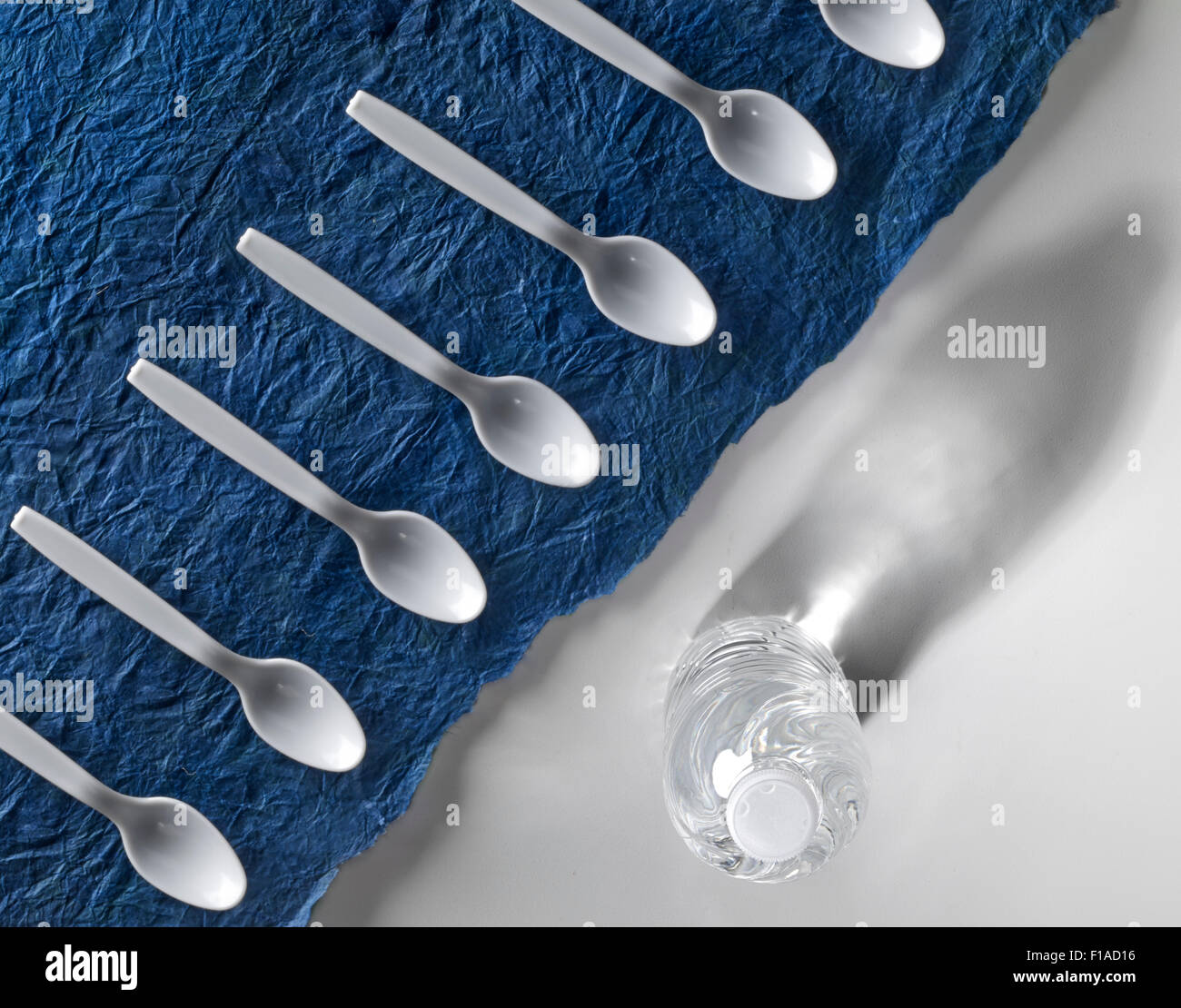 White Plastic Spoons & Water Bottle Stock Photo Alamy