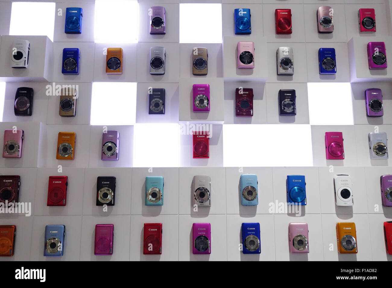 Hong Kong, China, various models of digital camera Canon Ixus hanging on a wall Stock Photo