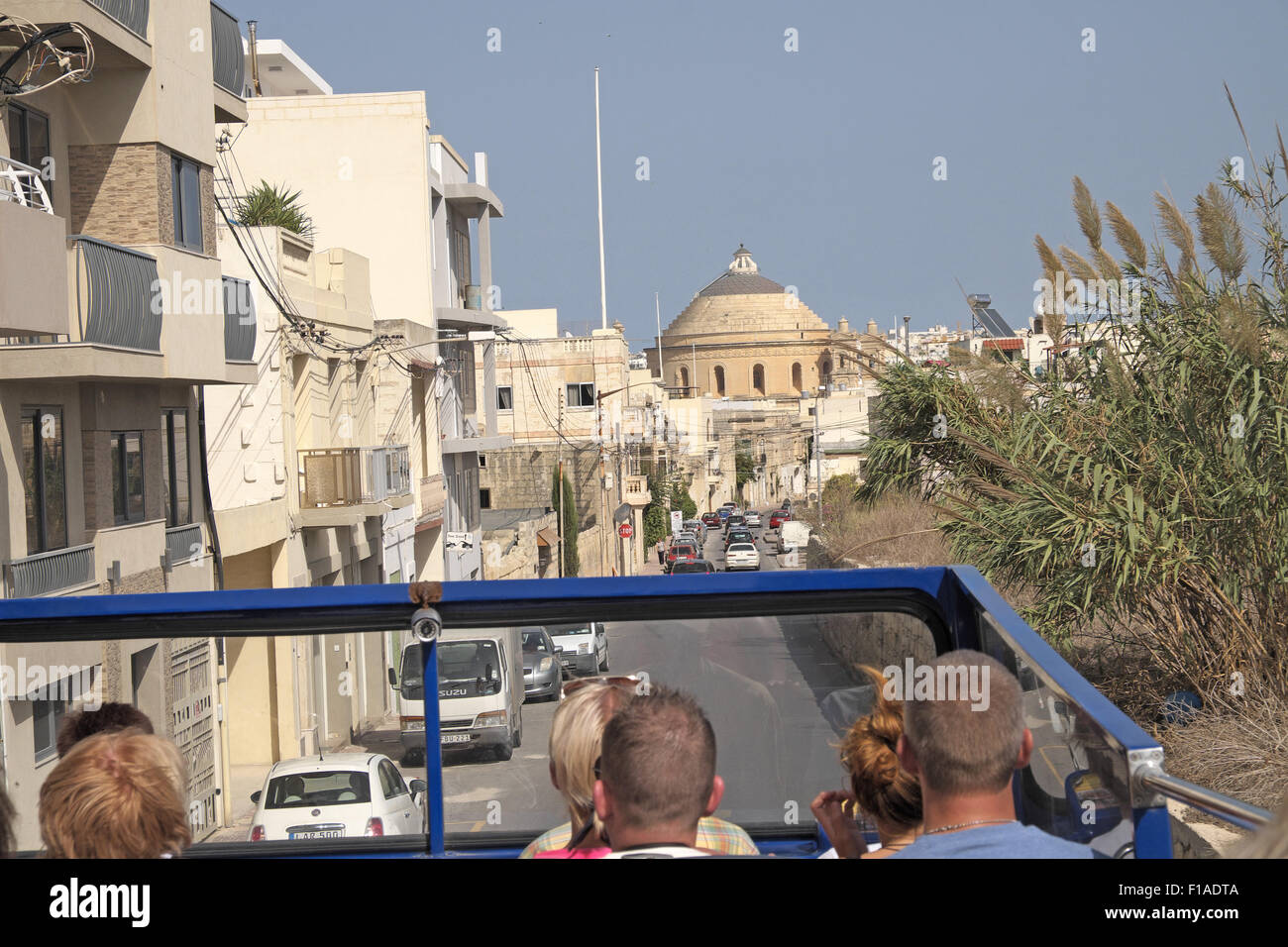 Rotunda of the Assumption seen from an open topped bus, Mosta, Malta. Stock Photo